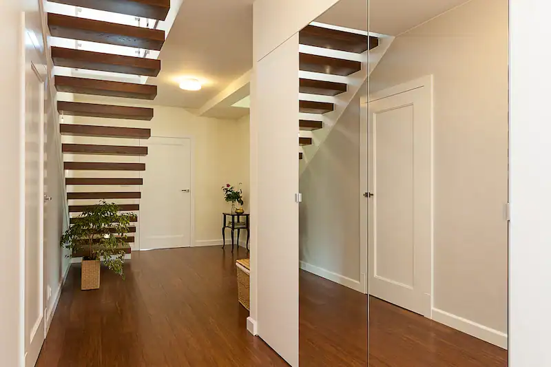 Bright entry room with custom entry mirror