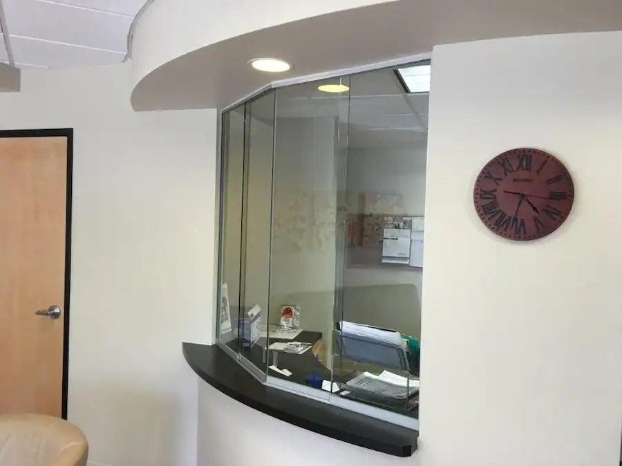 Custom glass office reception divider designed by A Pro Windows & Doors.