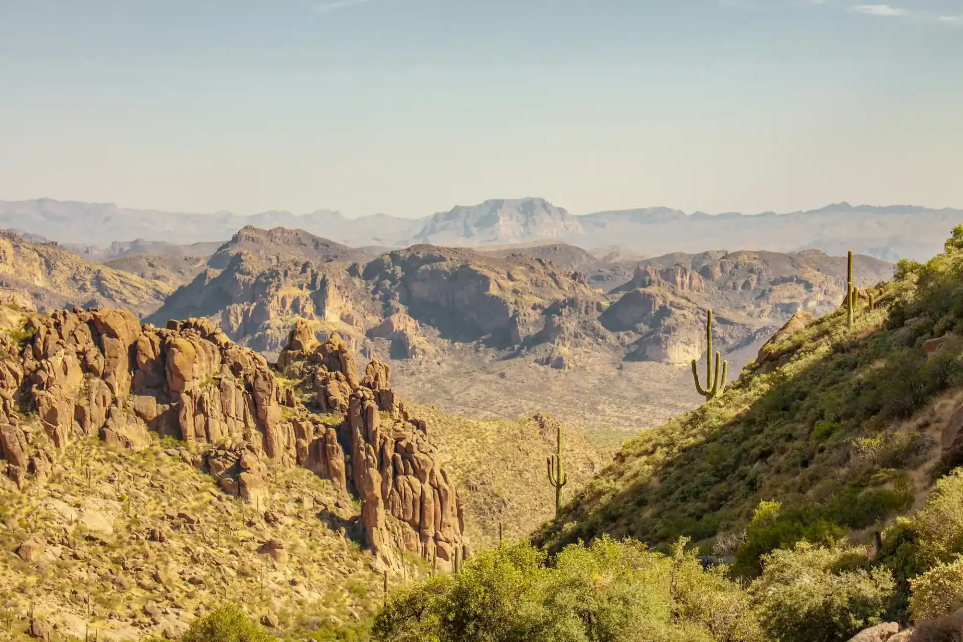 Desert mountains with cacti and rocky terrain.
